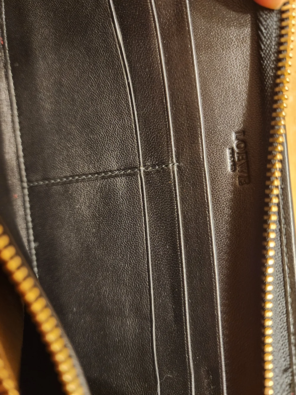 Loewe wallet features  vibrant red suede body & black crocodile Embossed Leather